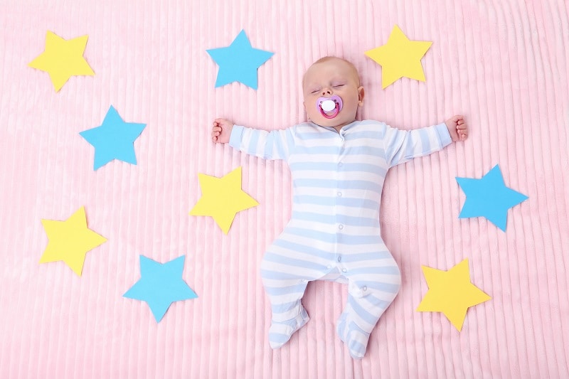 when do babies sleep through night