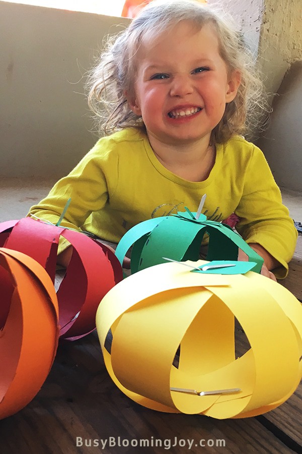Isla with finished cutting activity Fall craft