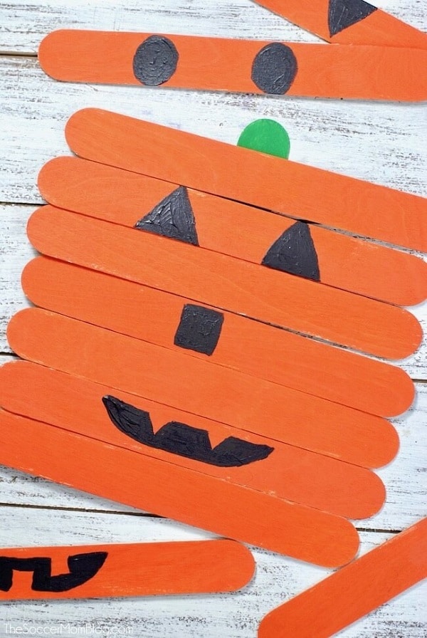 Pumpkin faces with craft sticks for toddlers