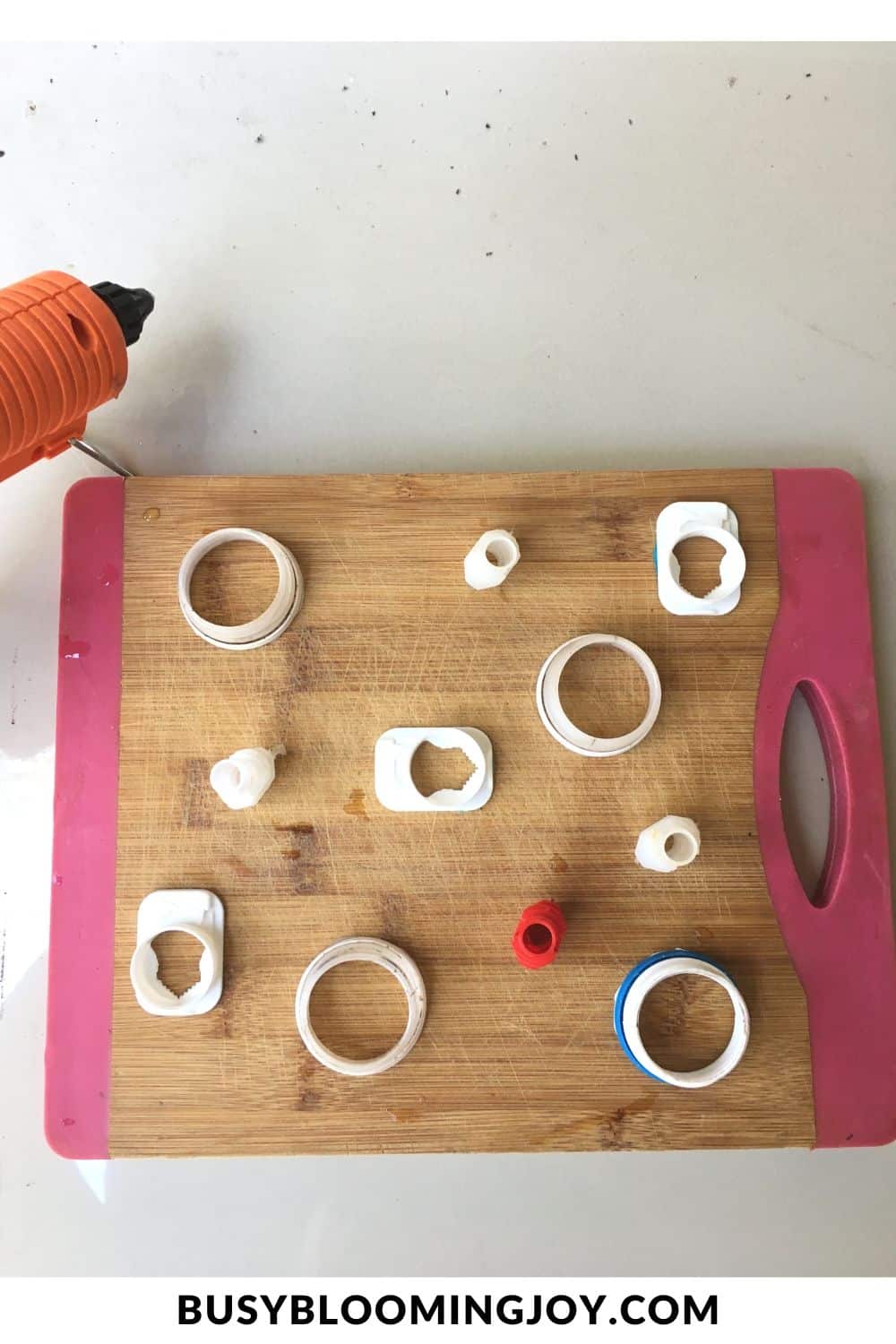 position the cut tops of bottles and plastic pouches on a breadboard