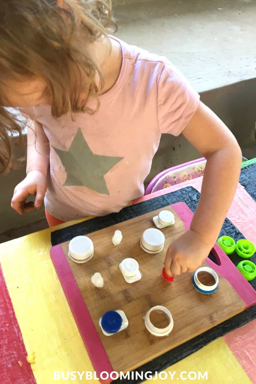 DIY fine motor toy being played with my toddler