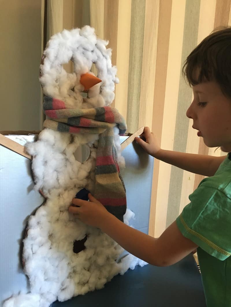 Bottle top posting Christmas activity for toddlers