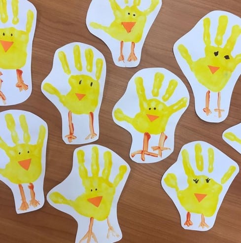 Handprint Easter chicks from @spanishclass4peques