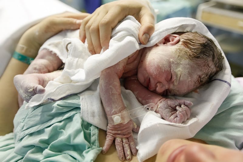 Wait a little while before bathing you newborn for the first time so the vernix stays for as long as possible