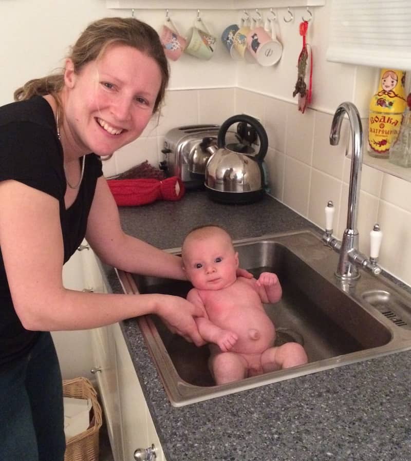 Learning how to bathe a newborn in the sink