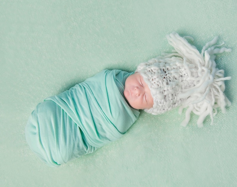 Swaddling is a must if you want to get a newborn to sleep in a bassinet instead of your arms