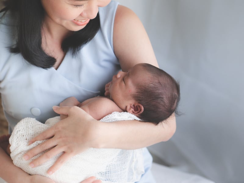 Holding a newborn in the cradel hold