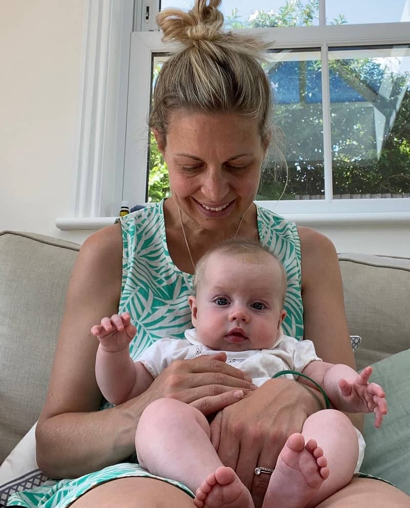 Holding a newborn in the chair hold means they can enjoy what's going on around them