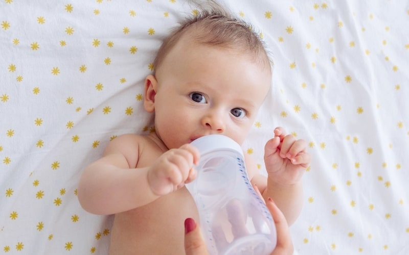 how to help a newborn poop: water in between feeds