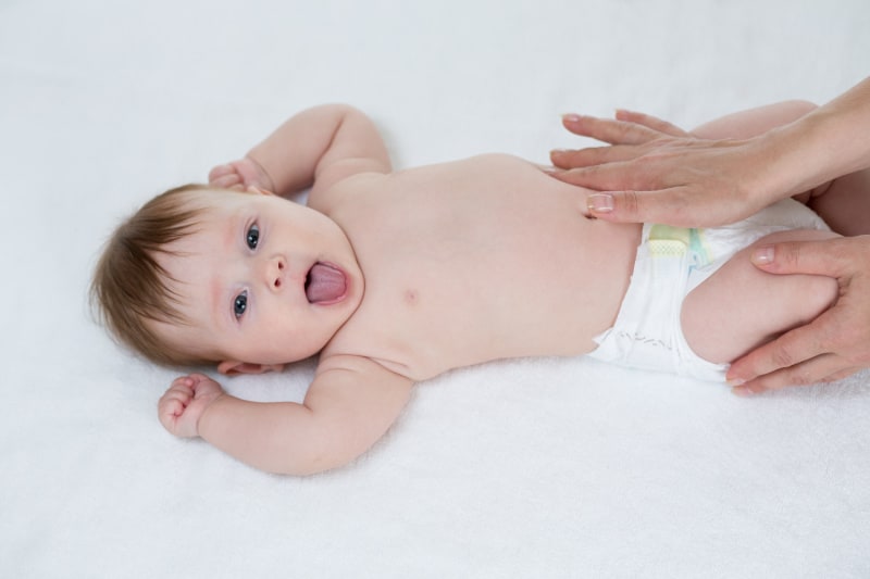 how to help a newborn poop: tummy massage