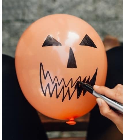 Halloween party ideas for toddlers - balloon filled candy to pop