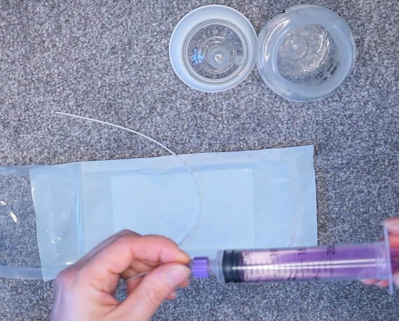 using the syringe to clean your DIY nursing supplementer