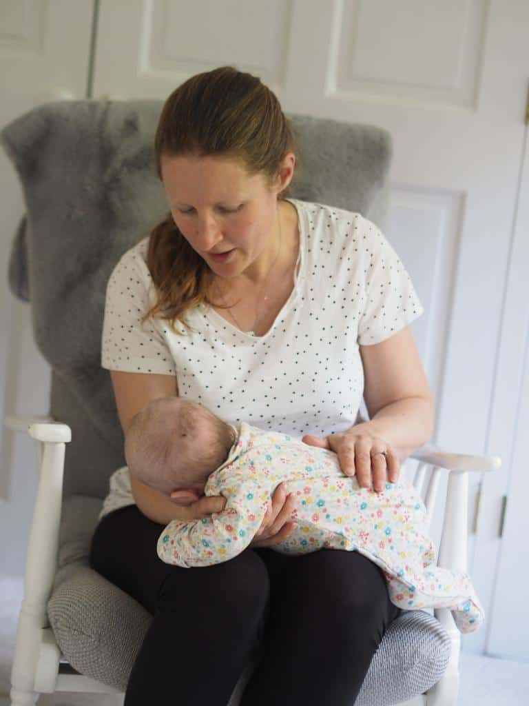 If your newborn won't burp, try some tummy time while baby on lap