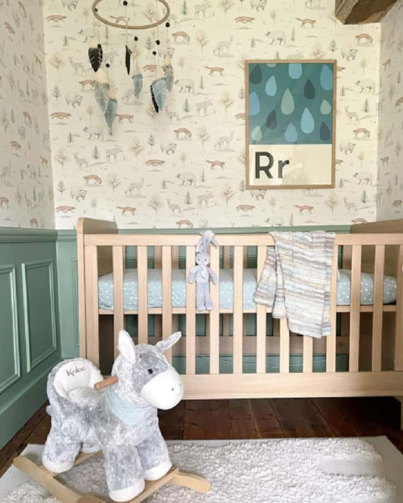 statement green wall nursery ideas with wallpaper