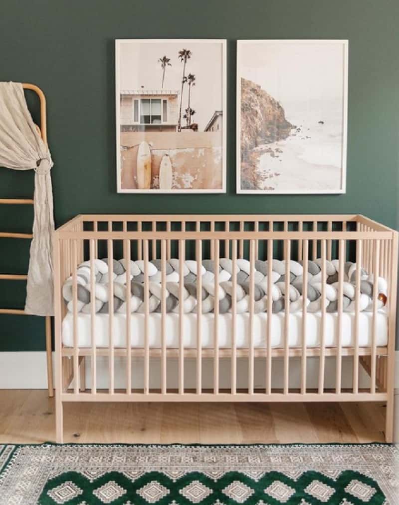 brown furniture against dark green wall for the nursery