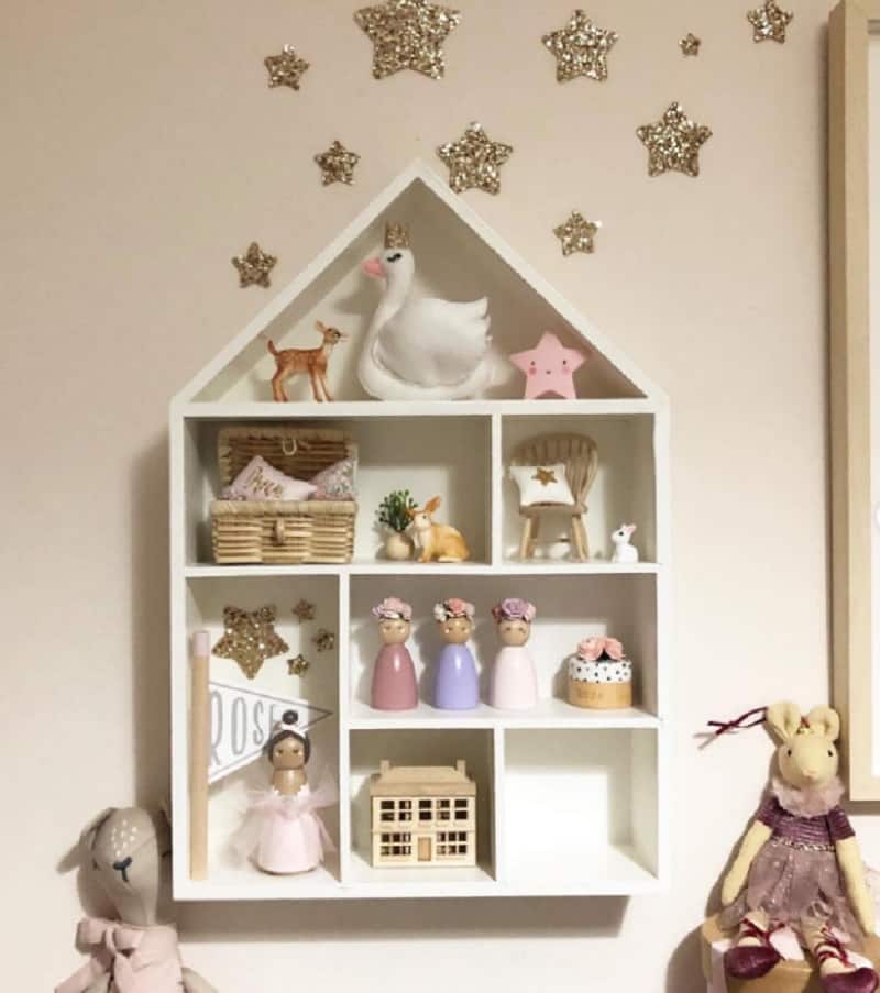 white wooden house as nursery wall shelves for baby room