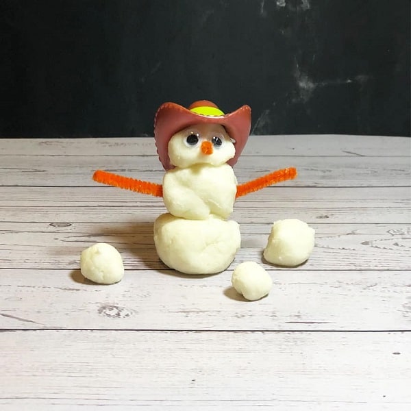 making cute little snowmen using fake snow dough