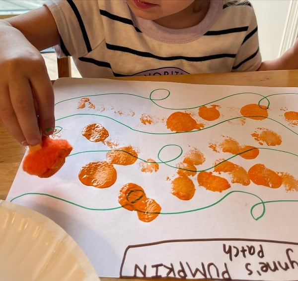 pumpkin patch stamping using pompoms as easy fall crafts for infants