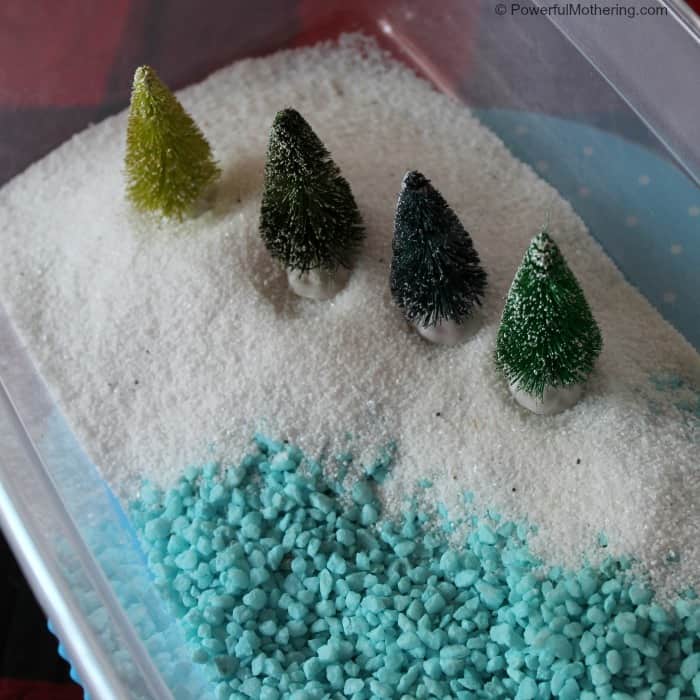 fun winter wonderland sensory bin using white sand