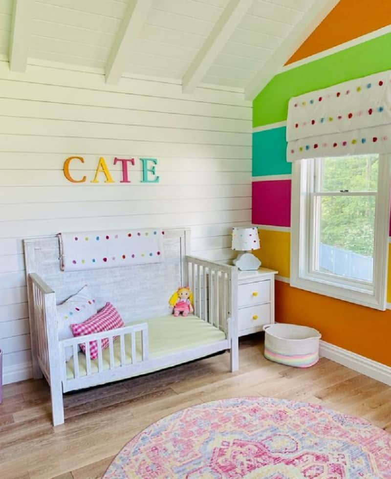 colorful rainbow stripes nursery wall