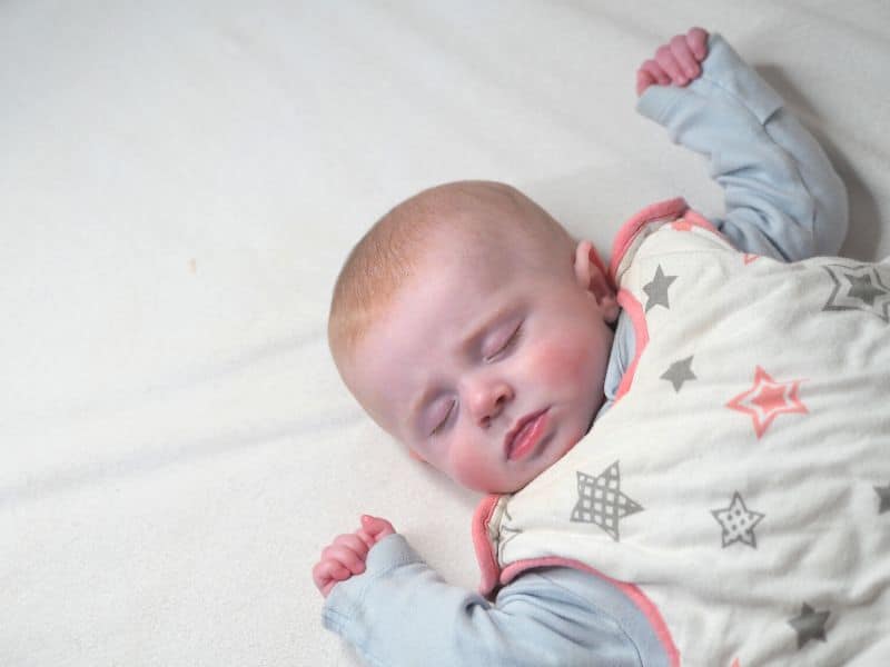 This newborn is in a sleep sack rather than a swaddle