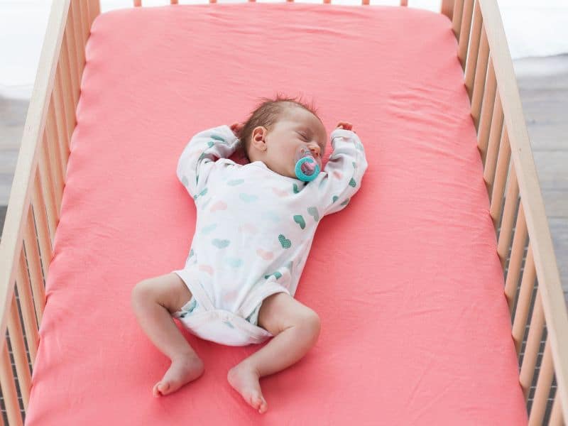 Whether you choose a swaddle or sleep sack, baby must sleep on their back