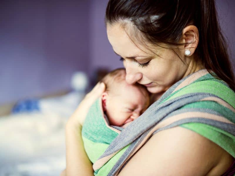 using a wrap or carrier to carry your newborn baby