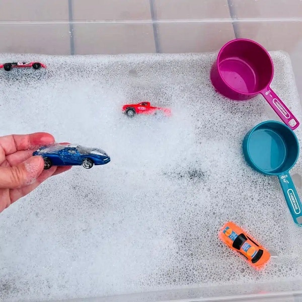 Car Wash Sensory Bin using cars, soap, water. fun water play