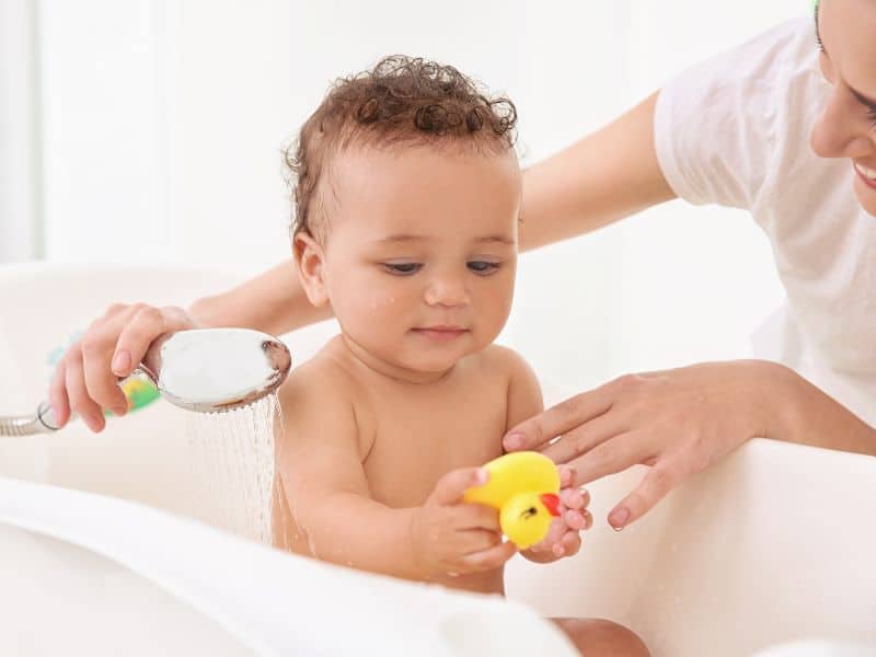 bath time as a fun sensory activity for a 5 month old baby