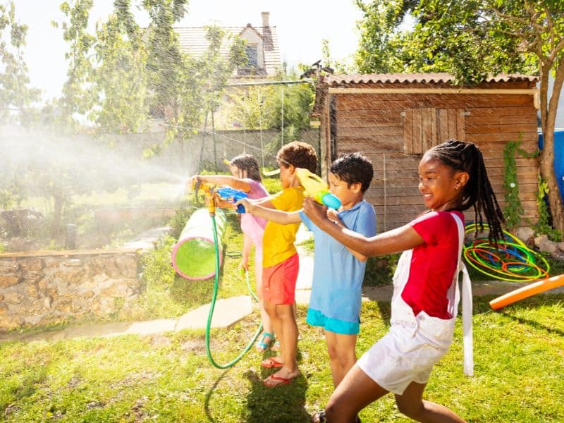 water gun fight for a fun outdoor birthday party