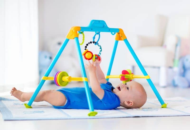 baby gym for a fun sensory activity for your 3 month old baby