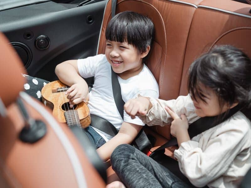 keep the kids entertained by singing songs during a road trip