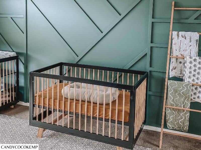 green paneled wall for the baby room