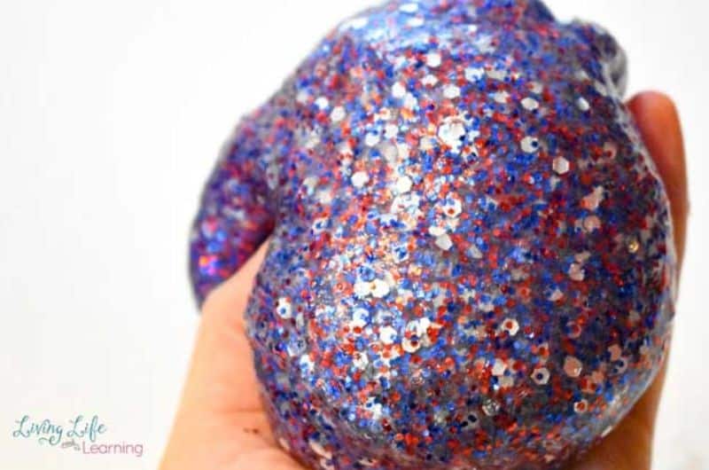 DIY sensory play with red, silver and blue glitters