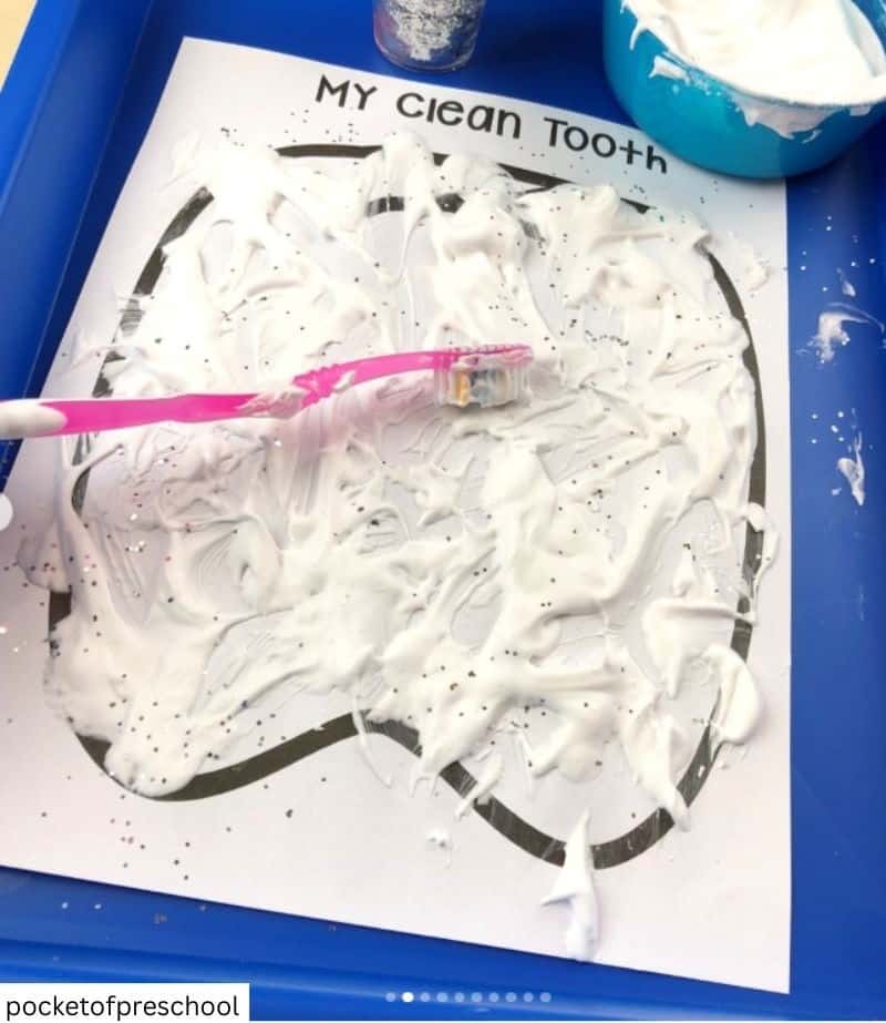 toddler brushing a printed tooth template