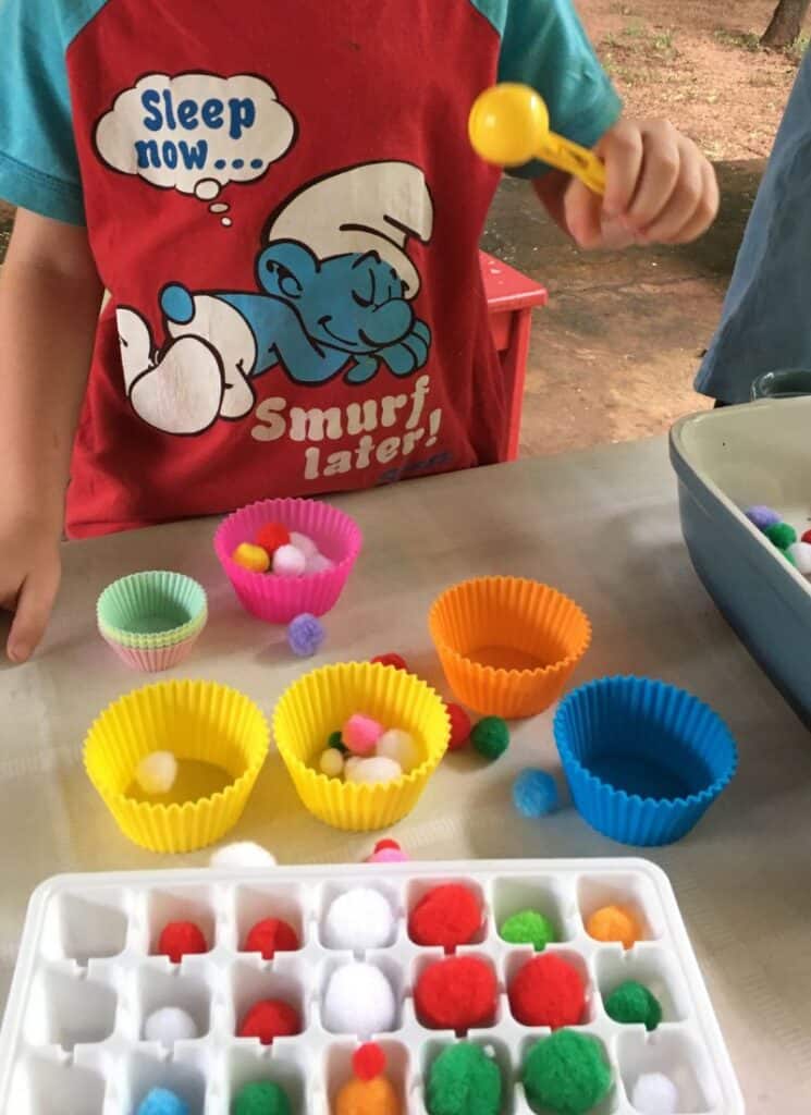 fine motor activity using ice cube tray, tweezers and tongs