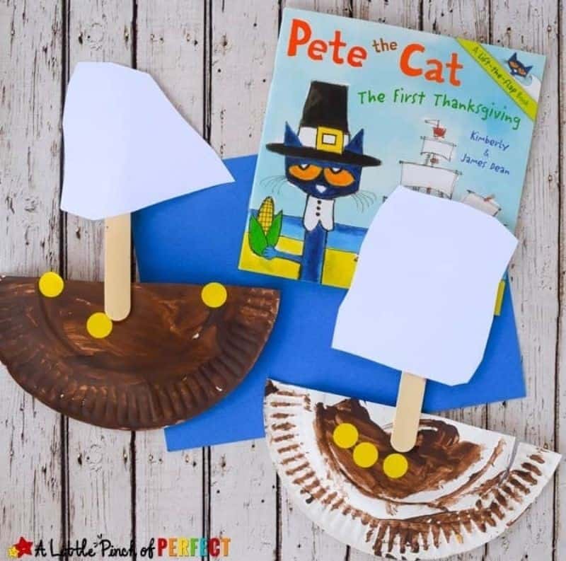 Handmade Mayflower ships created from paper plates, paint, and craft sticks inspired by Pete the Cat The first Thanksgiving