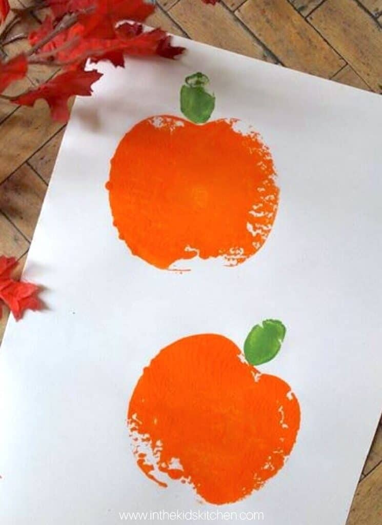 pumpkin apple stamping craft, which uses a cut apple as a stamp for the body