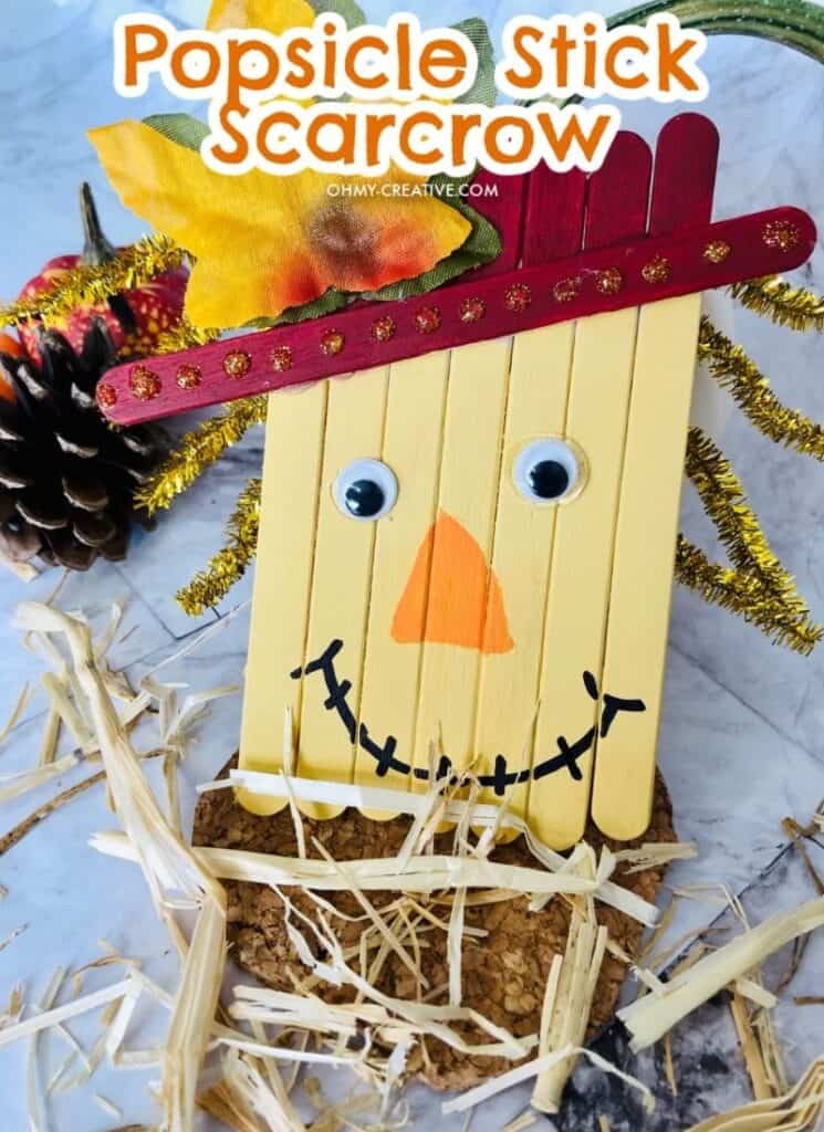 DIY scarecrow craft made from painted popsicle sticks